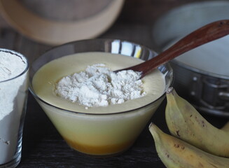 Confectionery background. Stage of cooking biscuit with banana. Cooking a pie of three ingredients.