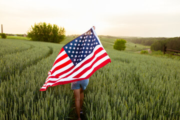 Independence day concept with woman lying down on american flag