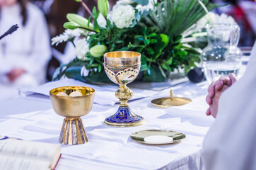 altar with host and chalice with wine in the churches of the pope of rome, francesco