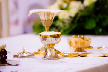 altar with host and chalice with wine in the churches of the pope of rome, francesco