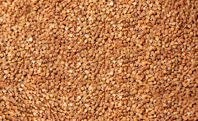 Background of raw buckwheat cereals from above