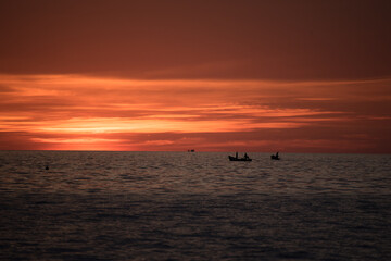 boat in sea with sunset