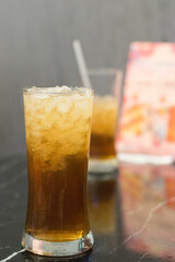 glass of ice tea blur background