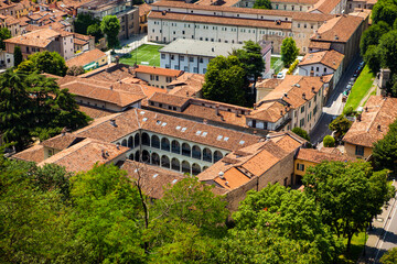Panoramic, aerial view of the historic centre of Brescia, Lombardy, Italy. Traditional medieval Europe with tiled red roofs, narrow streets, stone houses, Duomo,  Clock tower. Heritage. Architecture.