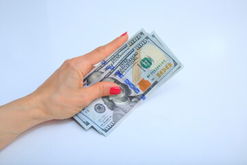 Usd banknote view in female hand on white background.