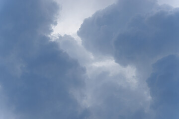 Stormy rain big fluffy clouds. Dark sky. Natural scenic abstract background. Weather changes backdrop. Sky filled with voluminous clouds.