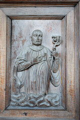 View of Santa Maria di Chiaravalle wood entrance door