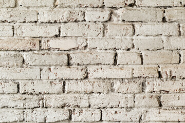 Abstract background old white brick wall with cracks and scratches. Landscape style. Great background or texture.
