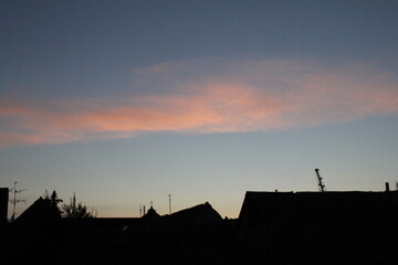roofs at sunset sky red cloud evening