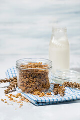 homemade granola and milk - healthy foods, vertical