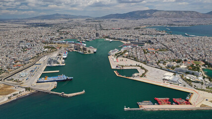 Aerial drone panoramic photo of famous port of Pireus or Piraeus where passenger ferries and cruises travel to popular Aegean island destinations as seen from high altitude, Attica, Greece