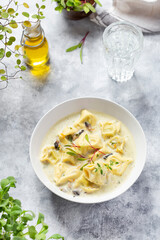 Tortellini pasta soup with spinach, carrot and chicken
