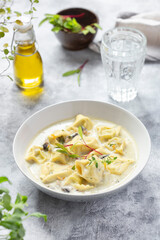 Tortellini pasta soup with spinach, carrot and chicken