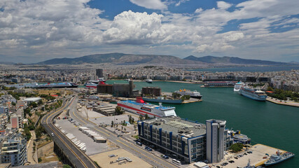 Aerial drone panoramic photo of famous port of Pireus or Piraeus where passenger ferries and cruises travel to popular Aegean island destinations as seen from high altitude, Attica, Greece