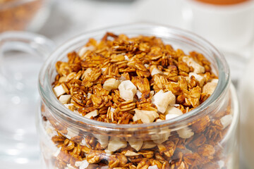 jar of sweet granola with coconut and nuts