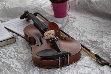 Violin and bow put on background,prepare for practice,blurry light around