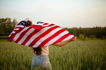 Independence day concept with woman lying down on american flag