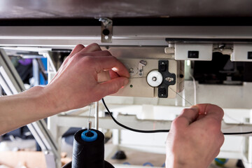 Fabric industry production line. Textile factory. Working tailoring process