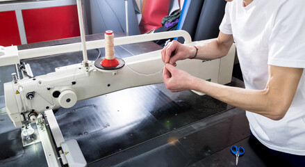 Fabric industry production line. Textile factory. Working tailoring process