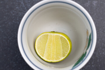 Lemons in a white cup