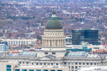 Fototapeta na wymiar The Utah State Capital Building against downtown Salt Lake City during winter