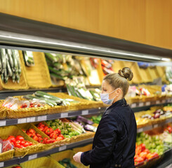 Supermarket shopping, face mask and gloves,Woman buying vegetables at the market	