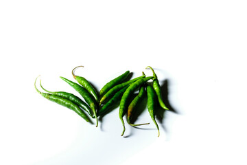 Obraz premium Isolated green chilis placed in a white background with space for text in the right