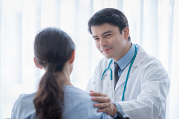 Fototapeta premium A doctor take care of sick patient woman at the hospital or medical clinic.