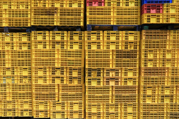 Many empty crate packaging background. Yellow texture background.