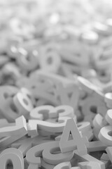 Grey monochrome colored random digit numbers heap background, algebra, education or science concept