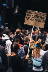 Black Lives Matter protest during lockdown coronavirus pandemic. Black lady with placard