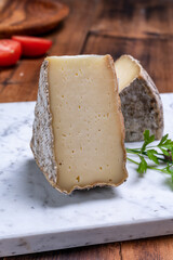 Cheese tomme de montagne or tomme de savoie made from cow milk in French Alps.