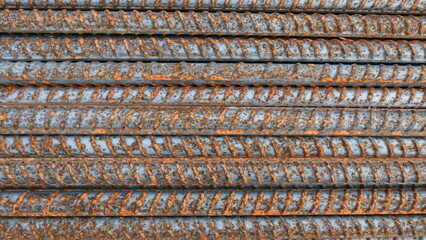 stack of rusty steel bars background texture or wallpaper