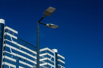 A modern street LED lighting pole. Urban electro-energy technologies. Savings on street urban road lighting. Energy saving. High tech. Eco-friendly smart city system.