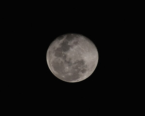 Full moon over black from clicked from Mumbai, India.