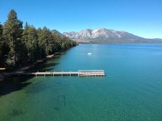Aerial view of Pier at Lake Tahoe, forest and mountains