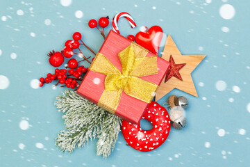 Christmas concept. Xmas composition with holly berries, gift  with snow