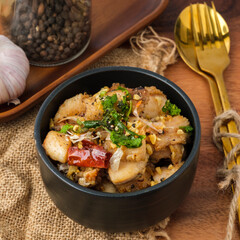 Naklejka premium Fried chicken with garlic and pepper with rice. Thai Dish.