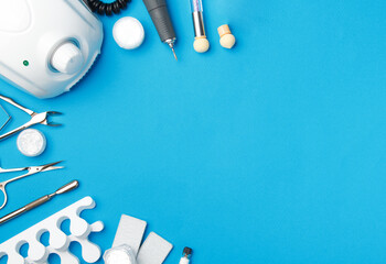 Professional manicure tools on blue background..