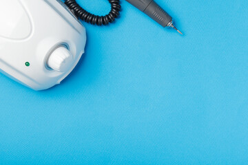 Professional manicure tools on blue background..
