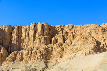 Fototapeta na wymiar Сliffs near the temple of Hatshepsut in a Luxor, Egypt
