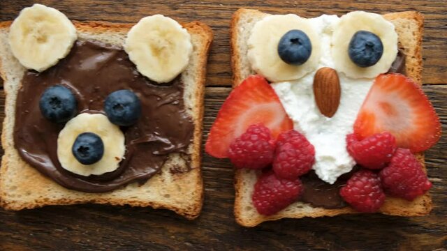 Chocolate nut butter toasts for kids with funny food art shaped as cute animals. Kids breakfast or school lunch ideas