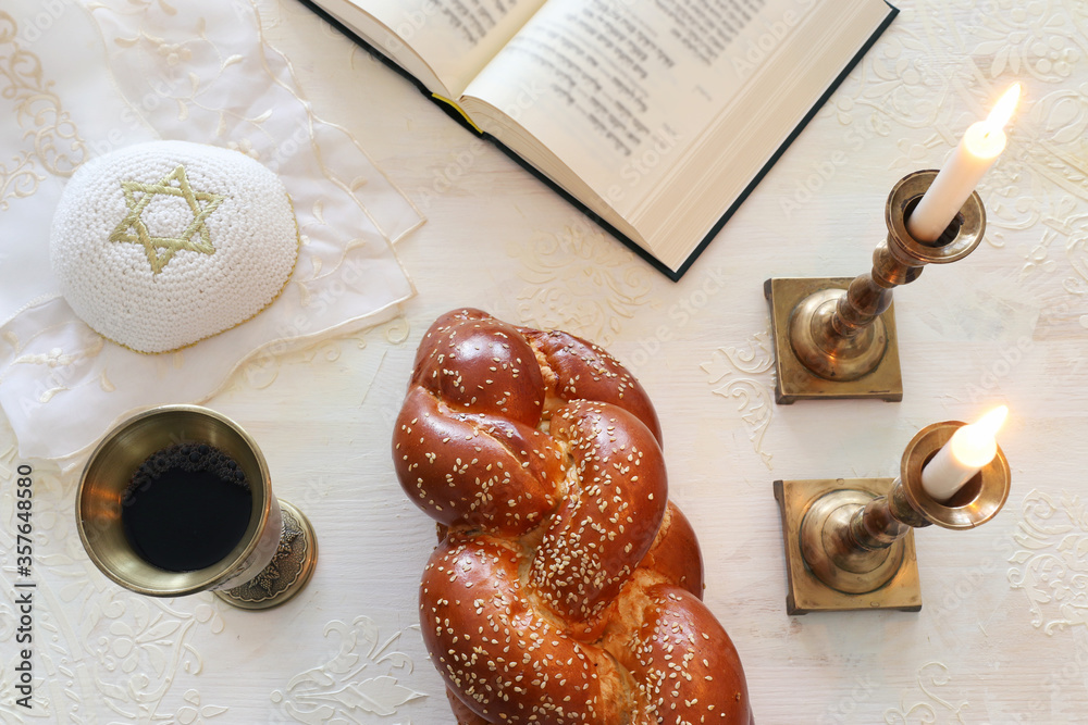 Wall mural shabbat image. challah bread, shabbat wine and candles. Top view