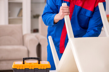 Young carpenter working indoors during pandemic disease