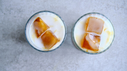 Ice cubes made with coffee in glass, preparing refreshing coffee drink