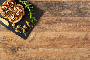 Traditional italian Bruschetta with tomatoes, olives and feta cheese.