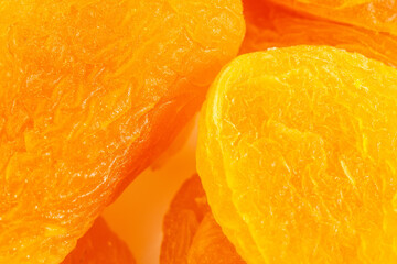 Fototapeta na wymiar Dried apricots Macro Heap of dried apricots close-up. selective focus