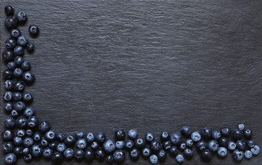 Photography of blueberries on slate background for menus, labels or signs