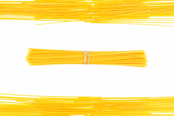 A frame made of pasta spaghetti, isolated on a white background with rolled up noodles inside.