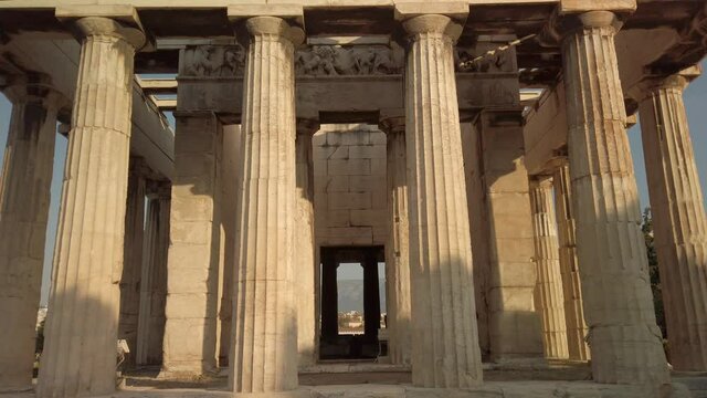 Amazing detailed tilt up view of the Temple of Hephaestus in ancient agora of Athens, Monastiraki district, Greece. The most well-preserved ancient Greek temple. POV from the base of the temple.
